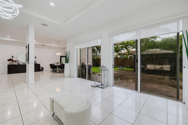 15104 SW 176th St, Miami, FL 33187 - tiled living area with plenty of natural light, a raised ceiling, recessed lighting, and french doors
