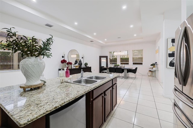 15104 SW 176th St, Miami, FL 33187 - kitchen with freestanding refrigerator, a sink, dishwashing machine, dark brown cabinets, and a raised ceiling