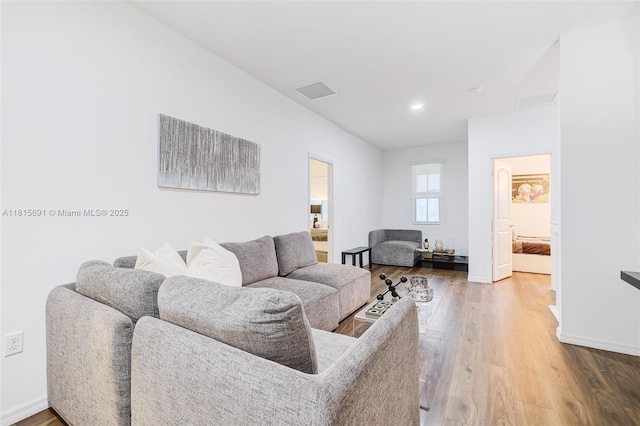 15104 SW 176th St, Miami, FL 33187 - living area with wood finished floors, baseboards, and recessed lighting