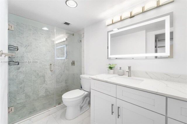 2851 NE 183rd St Unit 510E, Aventura, FL 33160 - bathroom featuring marble look tile flooring, vanity, toilet, a marble finish shower, and recessed lighting