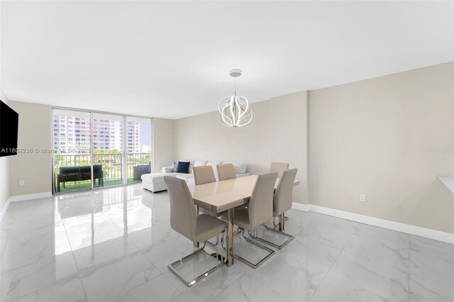 2851 NE 183rd St Unit 510E, Aventura, FL 33160 - dining space featuring marble finish floors, baseboards, a chandelier, and floor to ceiling windows