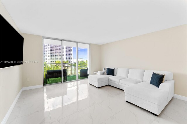 2851 NE 183rd St Unit 510E, Aventura, FL 33160 - living room featuring marble look tiles and baseboards