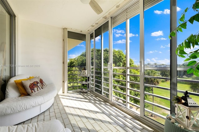 3850 E Oaks Clubhouse Dr Unit 504, Pompano Beach, FL 33069 - sunroom / solarium featuring ceiling fan