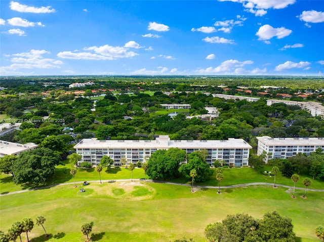 3850 E Oaks Clubhouse Dr Unit 504, Pompano Beach, FL 33069 - bird's eye view of apartment complex / building, a golf course, and a tree filled landscape