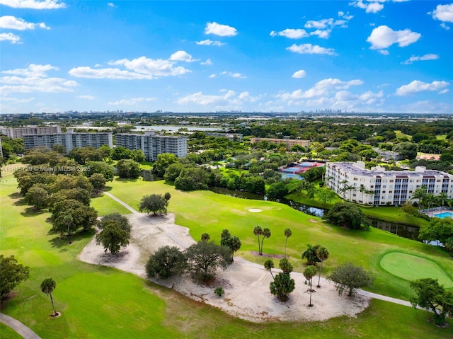 3850 E Oaks Clubhouse Dr Unit 504, Pompano Beach, FL 33069 - bird's eye view of a golf club, apartment complex, a tree filled landscape, and a large body of water