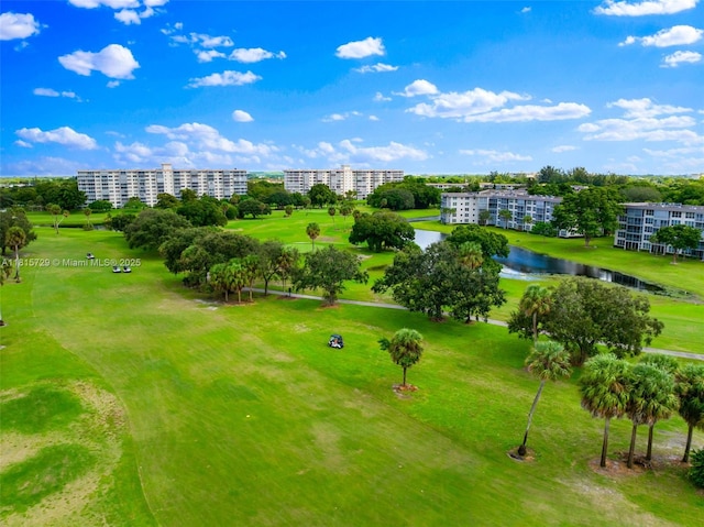 3850 E Oaks Clubhouse Dr Unit 504, Pompano Beach, FL 33069 - bird's eye view of apartment complex, a golf club, and a large body of water