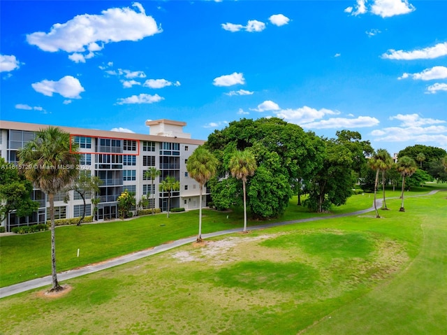 3850 E Oaks Clubhouse Dr Unit 504, Pompano Beach, FL 33069 - view of property's community featuring a yard and golf course view