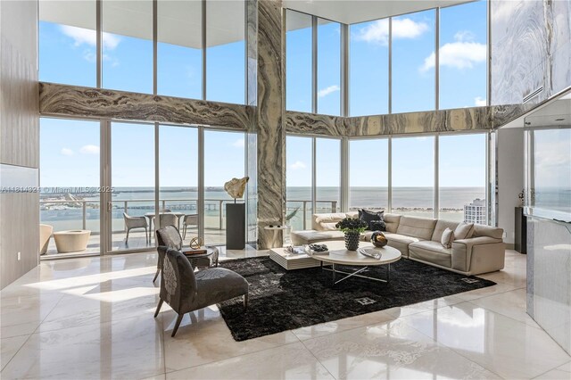 1300 Brickell Bay Dr Unit 4400, Miami, FL 33131 - living area featuring a high ceiling, a water view, and marble tiled floors