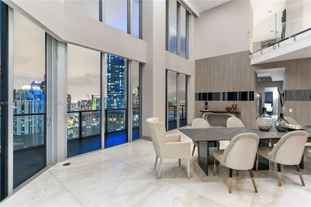 1300 Brickell Bay Dr Unit 4400, Miami, FL 33131 - dining space featuring a towering ceiling and a view of city