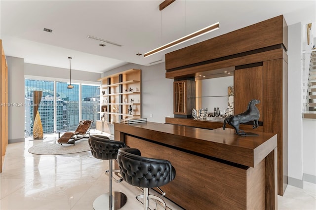1300 Brickell Bay Dr Unit 4400, Miami, FL 33131 - indoor dry bar featuring hanging light fixtures