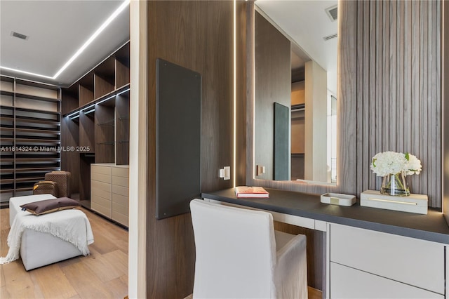 1300 Brickell Bay Dr Unit 4400, Miami, FL 33131 - spacious closet with wood finished floors and built in study area