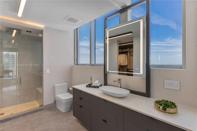 1300 Brickell Bay Dr Unit 4400, Miami, FL 33131 - bathroom featuring a stall shower, plenty of natural light, vanity, and toilet