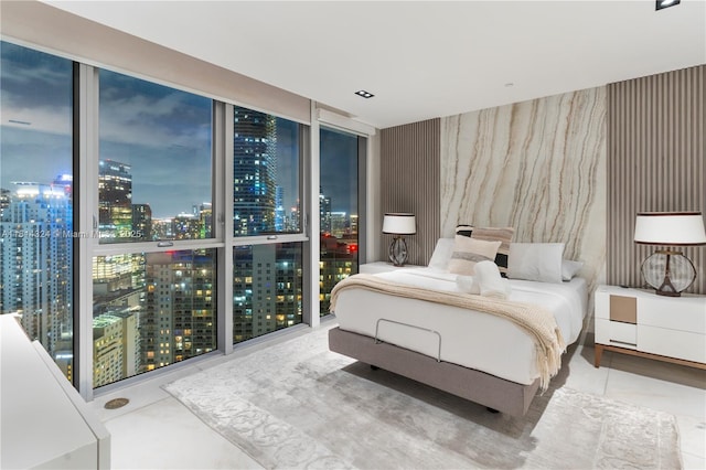 1300 Brickell Bay Dr Unit 4400, Miami, FL 33131 - bedroom with a view of city lights and a wall of windows