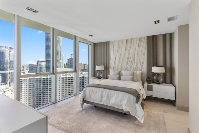 1300 Brickell Bay Dr Unit 4400, Miami, FL 33131 - bedroom with floor to ceiling windows, a skyline view, and baseboards