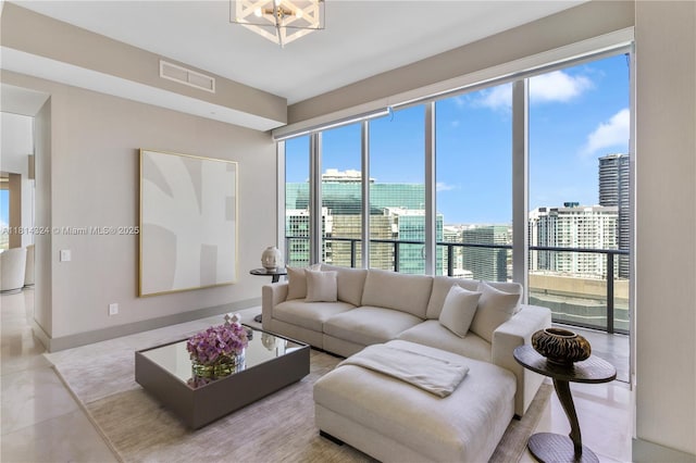 1300 Brickell Bay Dr Unit 4400, Miami, FL 33131 - tiled living area featuring a view of city, a chandelier, and baseboards