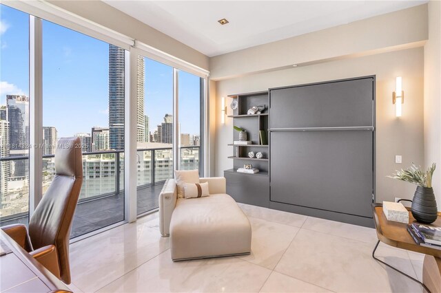 1300 Brickell Bay Dr Unit 4400, Miami, FL 33131 - sitting room with light tile patterned floors and a skyline view