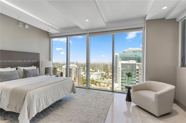 1300 Brickell Bay Dr Unit 4400, Miami, FL 33131 - bedroom with a view of city, light tile patterned floors, a wall of windows, and recessed lighting