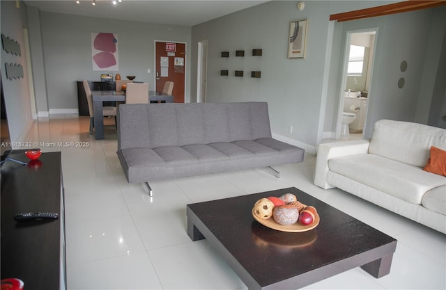 4001 S Ocean Dr Unit 11A, Hollywood, FL 33019 - living room featuring baseboards