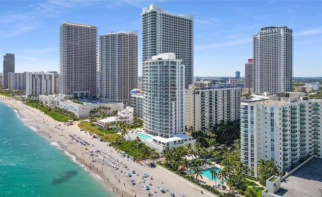 4001 S Ocean Dr Unit 11A, Hollywood, FL 33019 - bird's eye view of skyline, waterfront with a beach, and a pool area