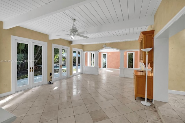 345 Harbor Ln, Key Biscayne, FL 33149 - empty room with ornate columns, french doors, a ceiling fan, baseboards, and light tile patterned flooring