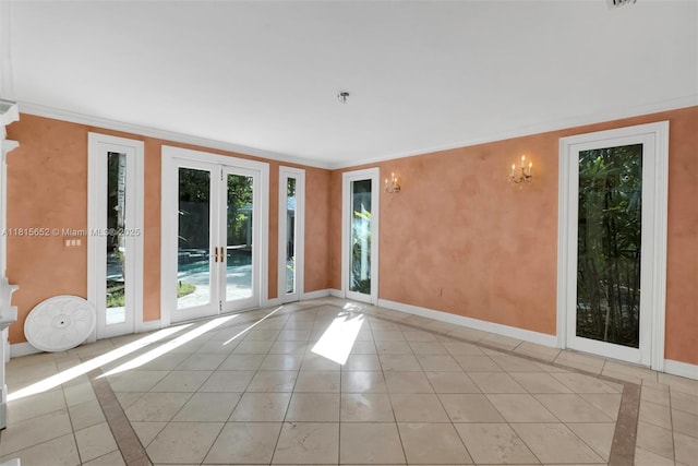 345 Harbor Ln, Key Biscayne, FL 33149 - empty room featuring inlaid floor details, baseboards, light tile patterned floors, ornamental molding, and fire sprinkler in ceiling