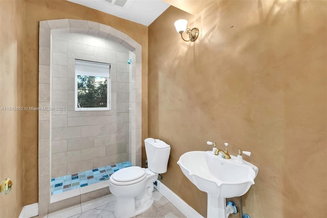 345 Harbor Ln, Key Biscayne, FL 33149 - full bathroom with toilet, tiled shower, tile patterned floors, baseboards, and a sink