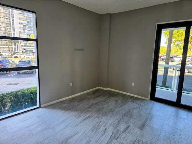 20505 E Country Club Dr Unit 138, Aventura, FL 33180 - spare room with baseboards and marble finish flooring