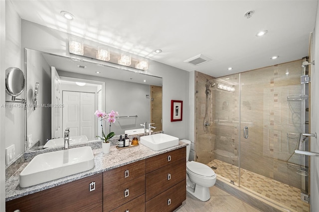 2000 N Bayshore Dr Unit 1011, Miami, FL 33137 - full bath featuring double vanity, a shower stall, recessed lighting, toilet, and tile patterned flooring