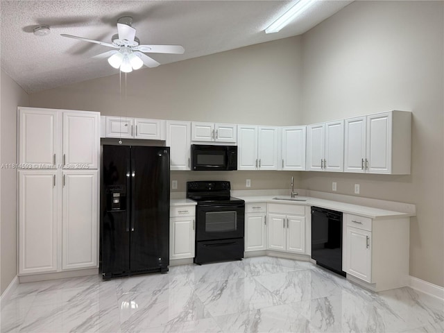 5416 Eagle Lake Dr Unit 4, Palm Beach Gardens, FL 33418 - kitchen with black appliances, light marble finish floors, a ceiling fan, light countertops, and high vaulted ceiling