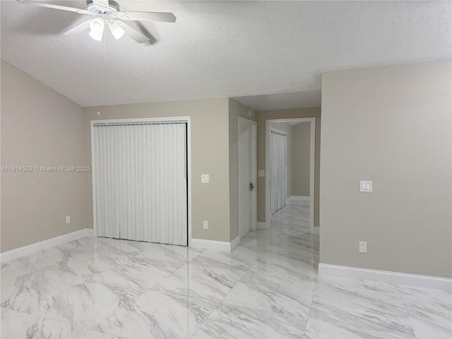 5416 Eagle Lake Dr Unit 4, Palm Beach Gardens, FL 33418 - empty room featuring light marble finish floors, a textured ceiling, and ceiling fan