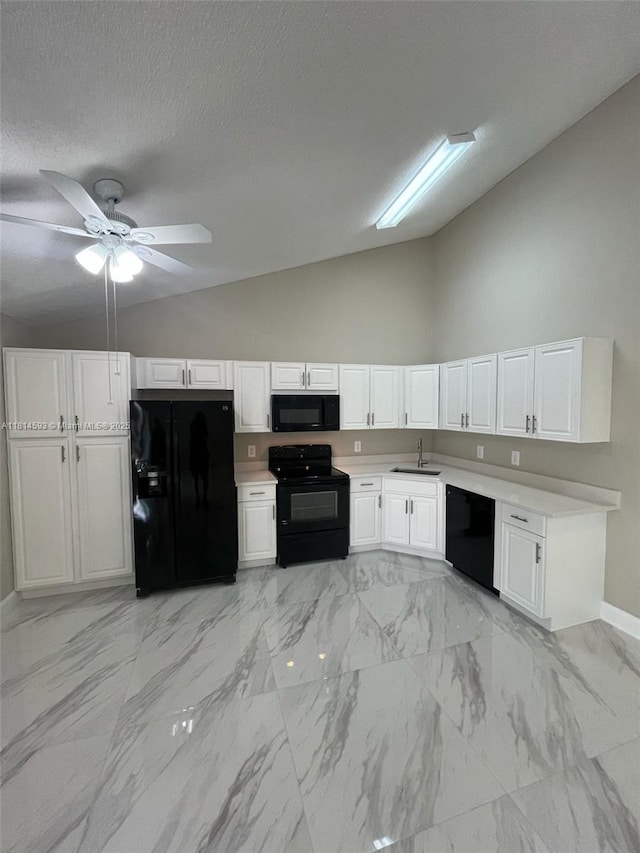 5416 Eagle Lake Dr Unit 4, Palm Beach Gardens, FL 33418 - kitchen featuring black appliances, vaulted ceiling, light countertops, white cabinetry, and a ceiling fan