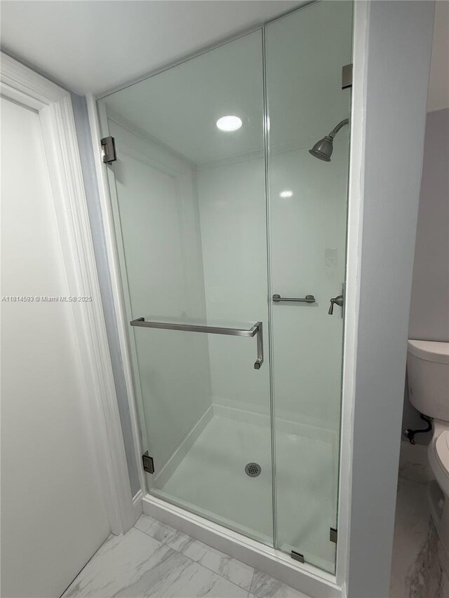 5416 Eagle Lake Dr Unit 4, Palm Beach Gardens, FL 33418 - full bathroom with marble look tile flooring and a stall shower