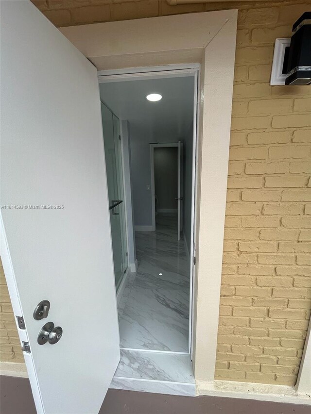 5416 Eagle Lake Dr Unit 4, Palm Beach Gardens, FL 33418 - bathroom featuring a marble finish shower, double vanity, and marble finish flooring