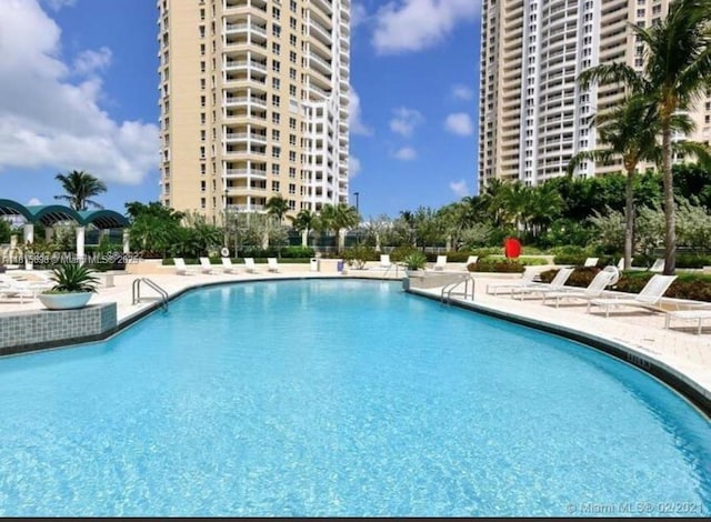 888 Brickell Key Dr Unit 2209, Miami, FL 33131 - community pool featuring a patio area