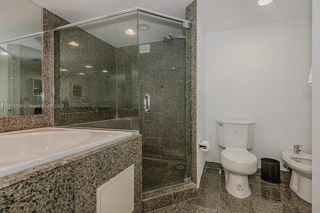 5600 Collins Ave Unit 10E, Miami Beach, FL 33140 - bathroom with a bidet, a shower stall, and toilet