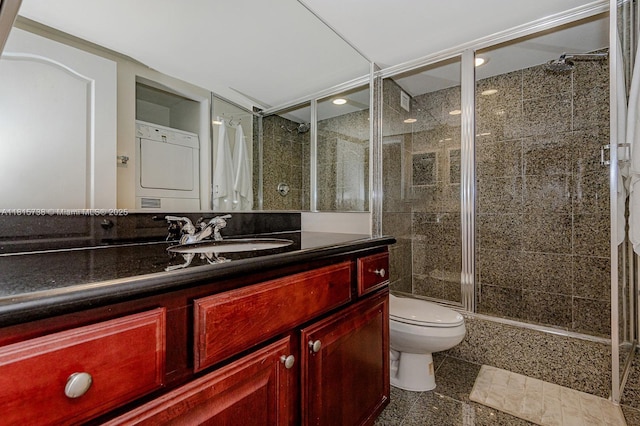 5600 Collins Ave Unit 10E, Miami Beach, FL 33140 - full bathroom with toilet, a stall shower, vanity, estacked washer and dryer, and recessed lighting
