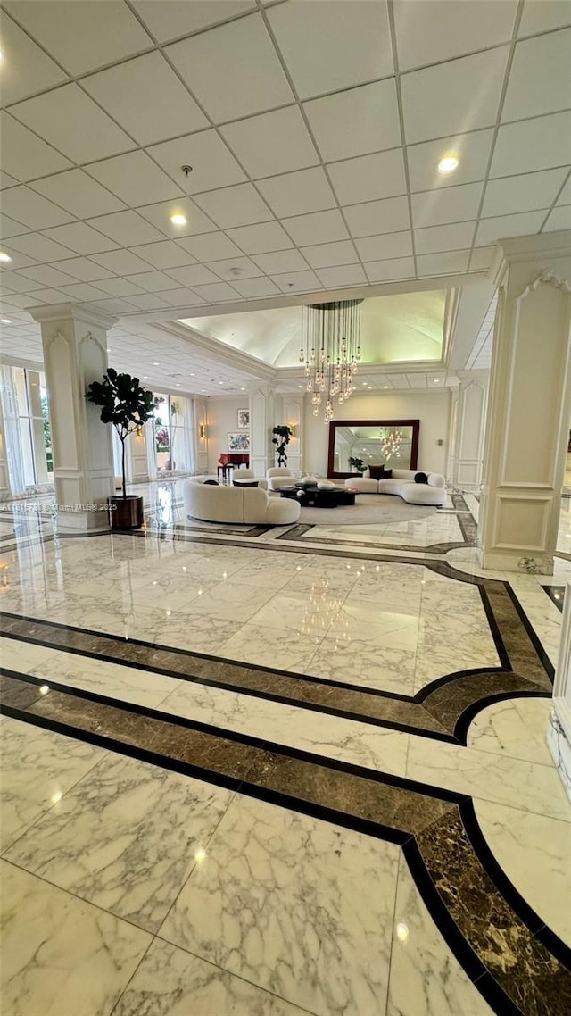 5600 Collins Ave Unit 10E, Miami Beach, FL 33140 - building lobby featuring a drop ceiling and recessed lighting