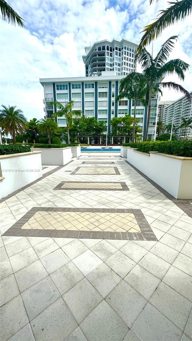 5600 Collins Ave Unit 10E, Miami Beach, FL 33140 - view of property's community featuring a patio and a swimming pool