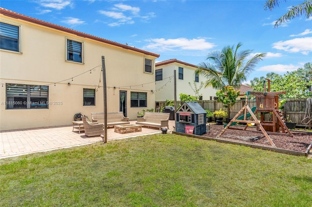 724 SE 37th Ave, Homestead, FL 33033 - rear view of property featuring an outdoor living space, a playground, a patio, and stucco siding