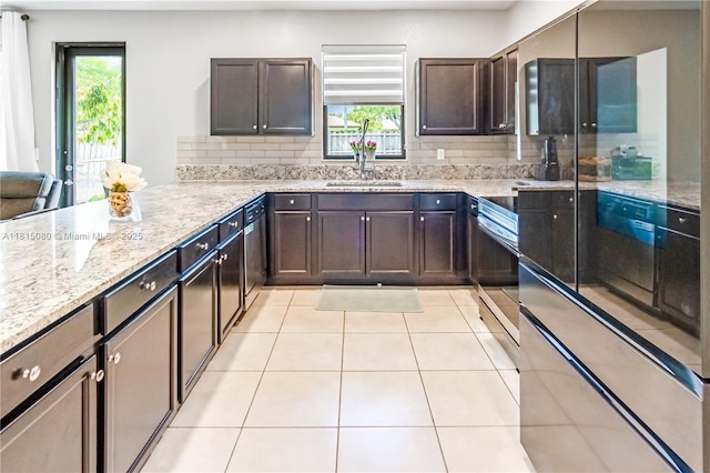 724 SE 37th Ave, Homestead, FL 33033 - kitchen with a sink, appliances with stainless steel finishes, light tile patterned floors, and light stone counters