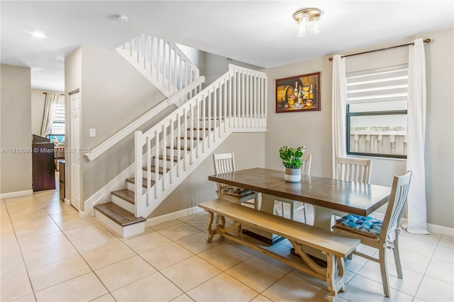 724 SE 37th Ave, Homestead, FL 33033 - dining space with stairway, baseboards, and light tile patterned floors