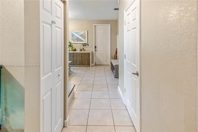 724 SE 37th Ave, Homestead, FL 33033 - hallway with a textured wall and light tile patterned floors