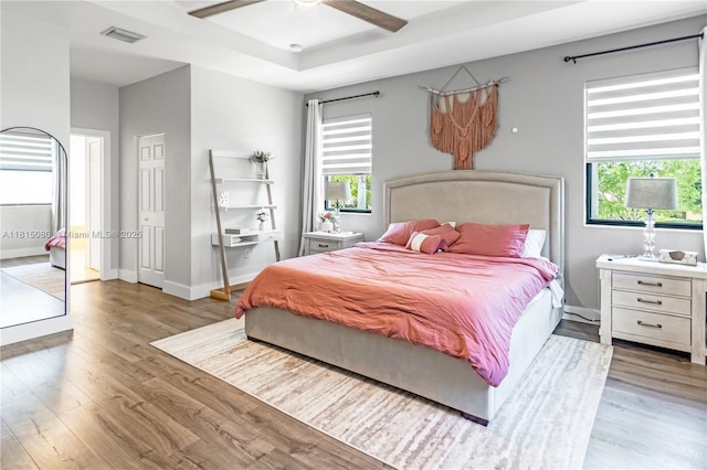 724 SE 37th Ave, Homestead, FL 33033 - bedroom with wood finished floors, multiple windows, ceiling fan, and baseboards