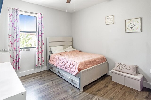 724 SE 37th Ave, Homestead, FL 33033 - bedroom featuring wood finished floors, baseboards, and ceiling fan