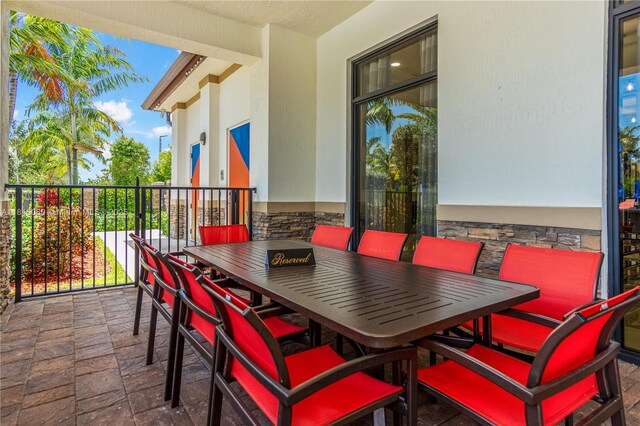 724 SE 37th Ave, Homestead, FL 33033 - view of patio / terrace featuring outdoor dining space and a balcony