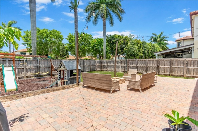724 SE 37th Ave, Homestead, FL 33033 - fenced backyard featuring a patio area and an outdoor living space