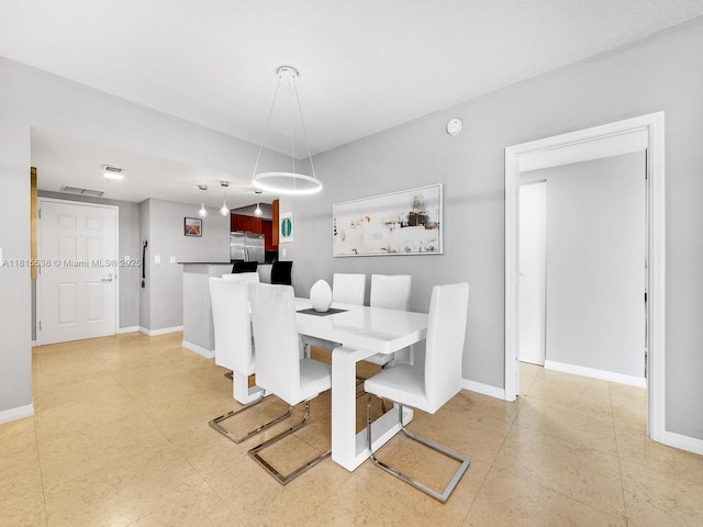16699 Collins Ave Unit 2906, Sunny Isles Beach, FL 33160 - dining area with baseboards and light tile patterned floors