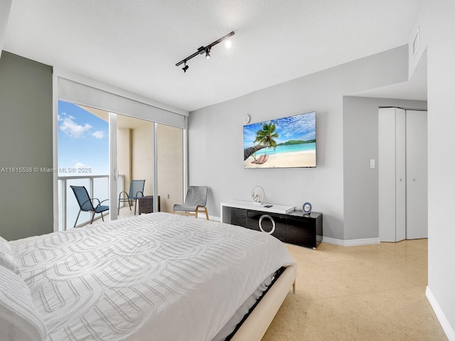 16699 Collins Ave Unit 2906, Sunny Isles Beach, FL 33160 - bedroom featuring baseboards and rail lighting