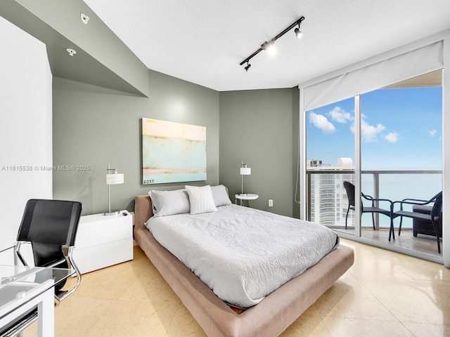 16699 Collins Ave Unit 2906, Sunny Isles Beach, FL 33160 - bedroom with expansive windows, light tile patterned floors, access to outside, and rail lighting
