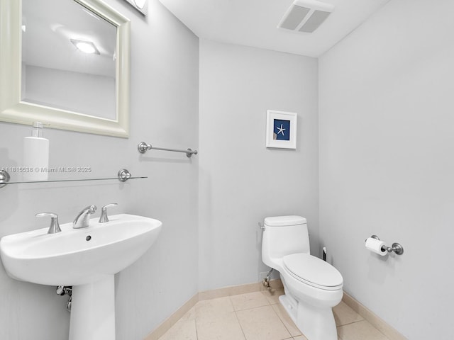 16699 Collins Ave Unit 2906, Sunny Isles Beach, FL 33160 - bathroom with toilet, tile patterned flooring, baseboards, and a sink